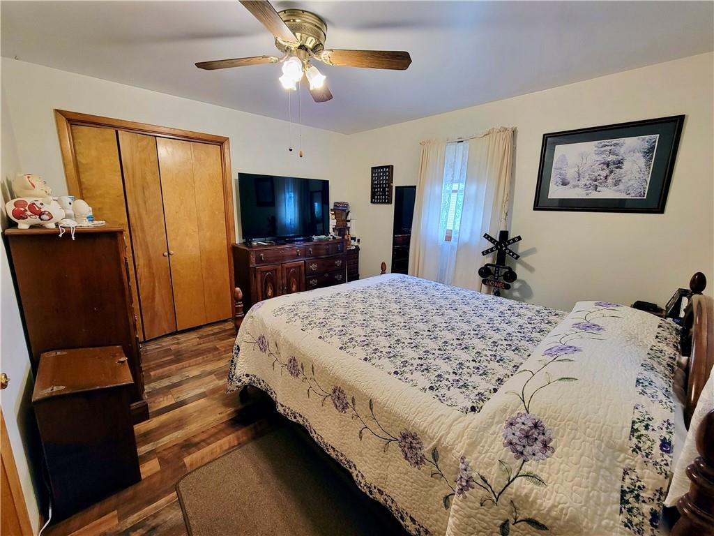 311 Elm Street Vandergrift, PA 15690 - Photo 16 of 47 a bed room with a bed window and a flat screen tv