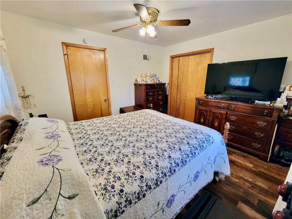 311 Elm Street Vandergrift, PA 15690 - Photo 18 of 47 a bedroom with a bed and a flat screen tv