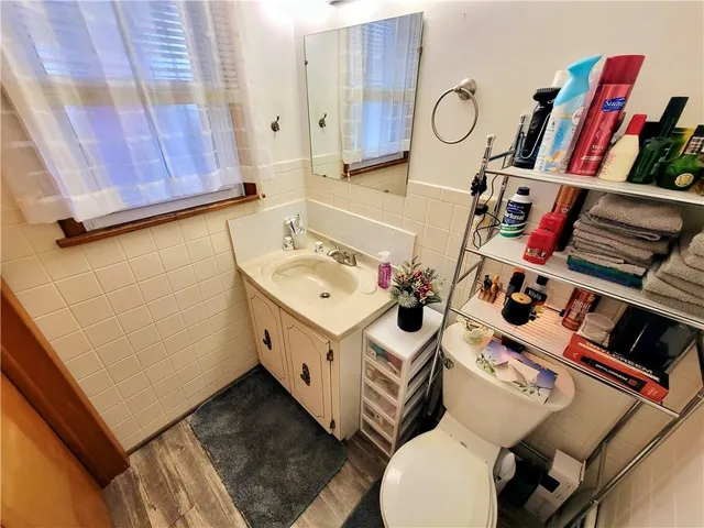 a bed room with furniture and a flat screen tv