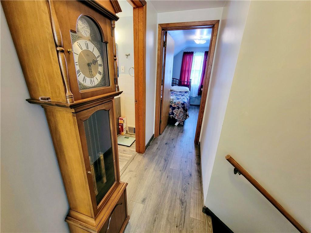 311 Elm Street Vandergrift, PA 15690 - Photo 25 of 47 a view of a hallway with wooden floor and staircase