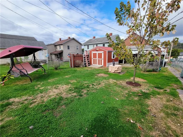 a view of a house with porch and wooden floor