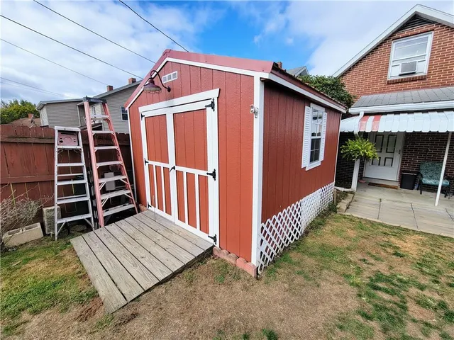 a view of a patio with a table and chairs