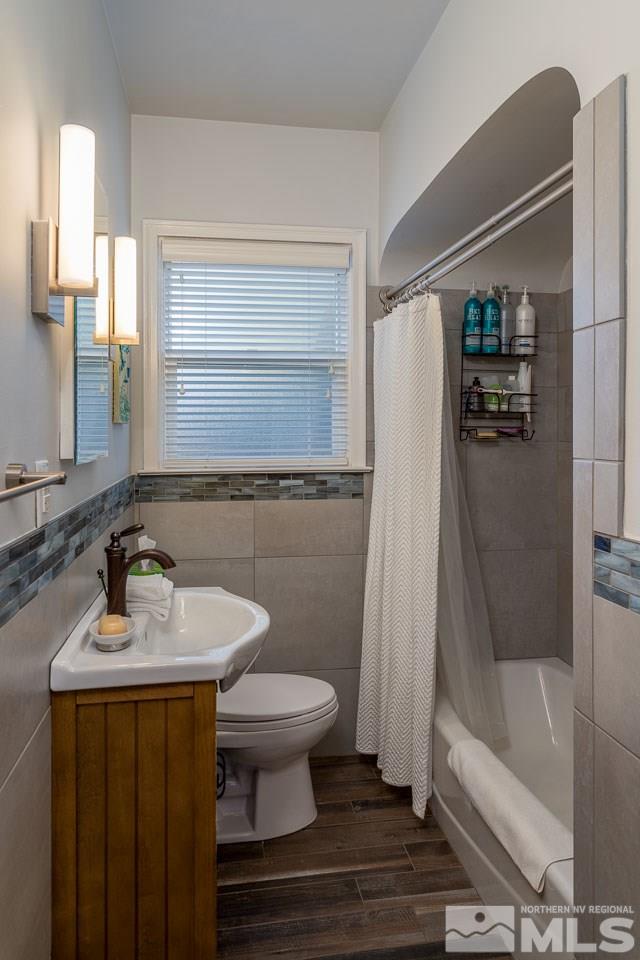 1011 Wright Street Reno, NV 89509 - Photo 13 of 21 a bathroom with a sink a toilet and shower