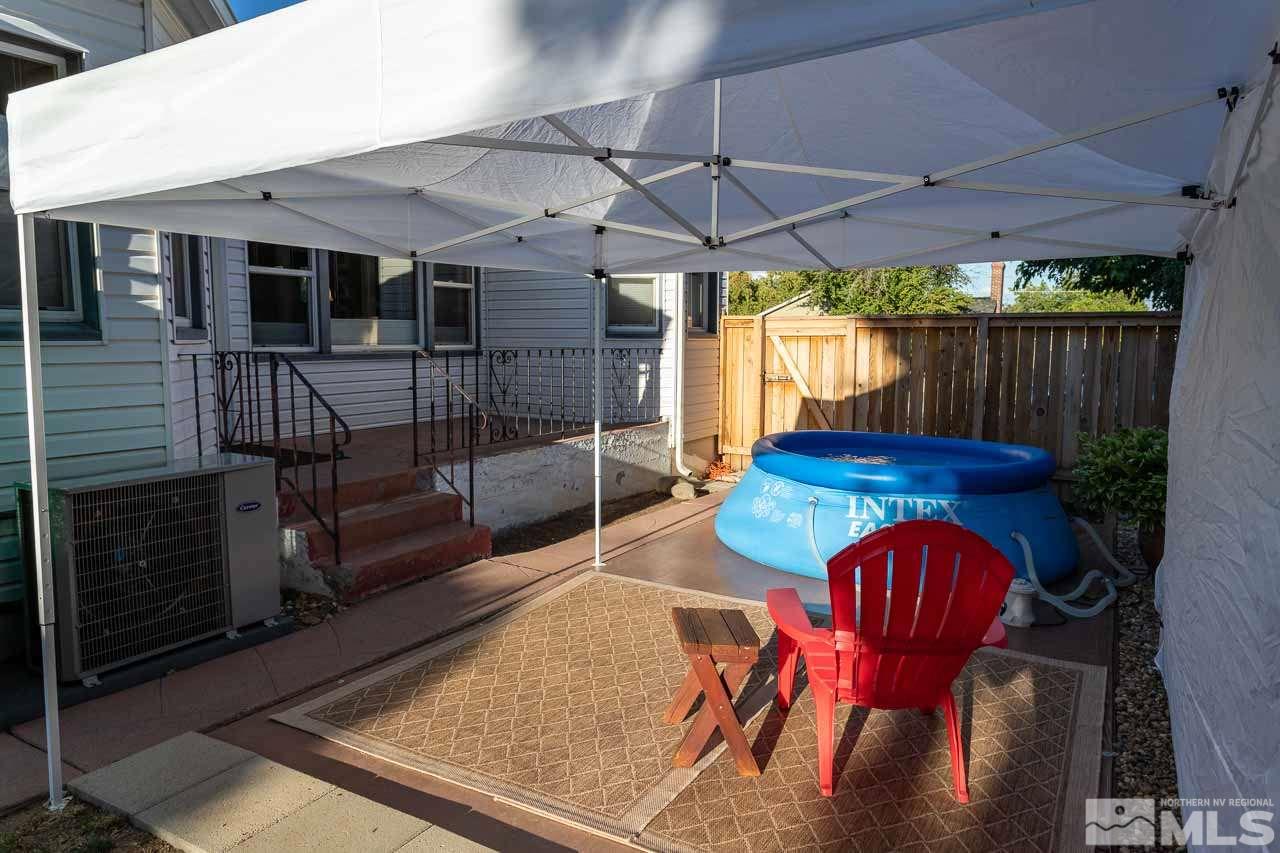 1011 Wright Street Reno, NV 89509 - Photo 18 of 21 a view of a patio with table and chairs with wooden floor fence and floor
