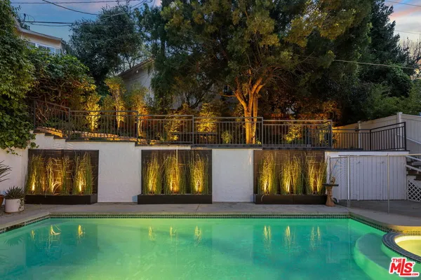 a view of swimming pool with a yard