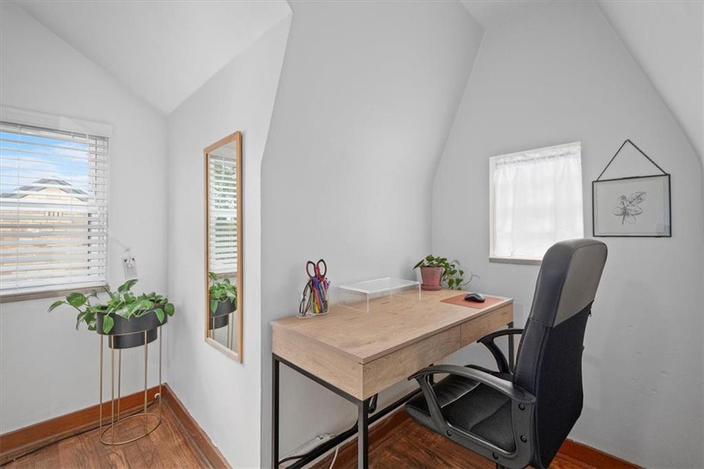 4746 Theodore Street Homestead, PA 15120 - Photo 16 of 25 a view of a workspace with furniture and a potted plant