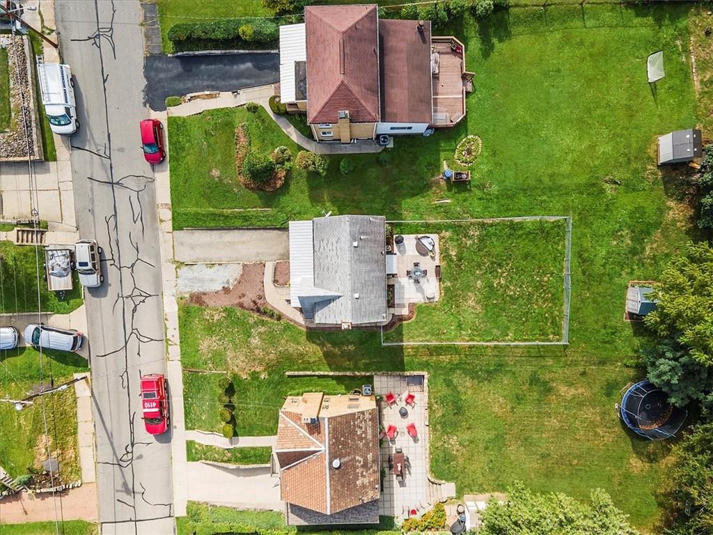 4746 Theodore Street Homestead, PA 15120 - Photo 2 of 25 an aerial view of house with yard swimming pool and outdoor seating