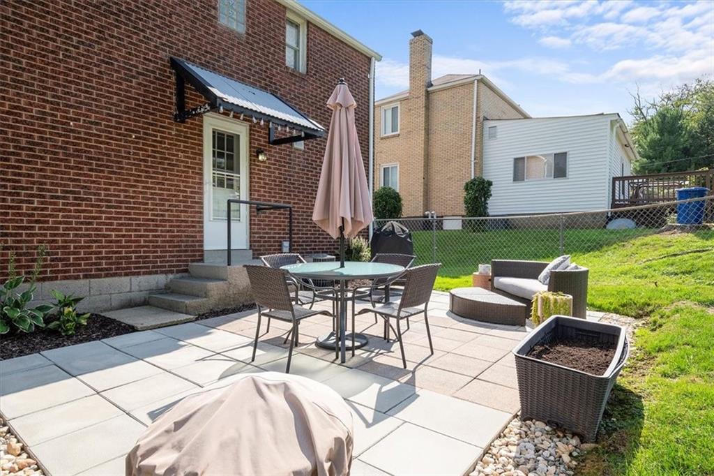 4746 Theodore Street Homestead, PA 15120 - Photo 23 of 25 a view of backyard of house with seating space