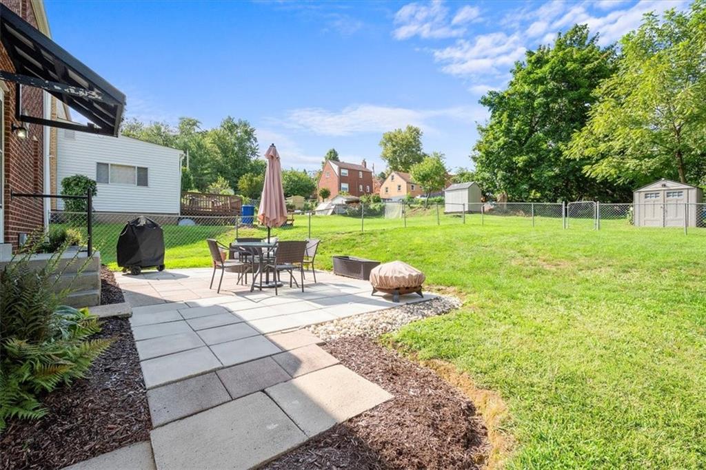 4746 Theodore Street Homestead, PA 15120 - Photo 25 of 25 a view of backyard with swimming pool and green space