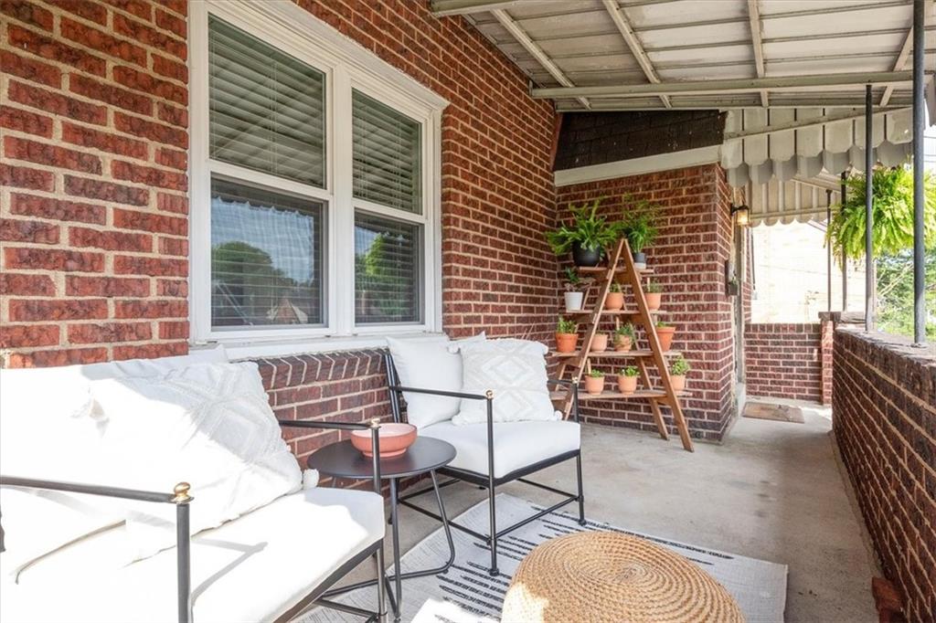 4746 Theodore Street Homestead, PA 15120 - Photo 3 of 25 a view of a patio with a table and chairs