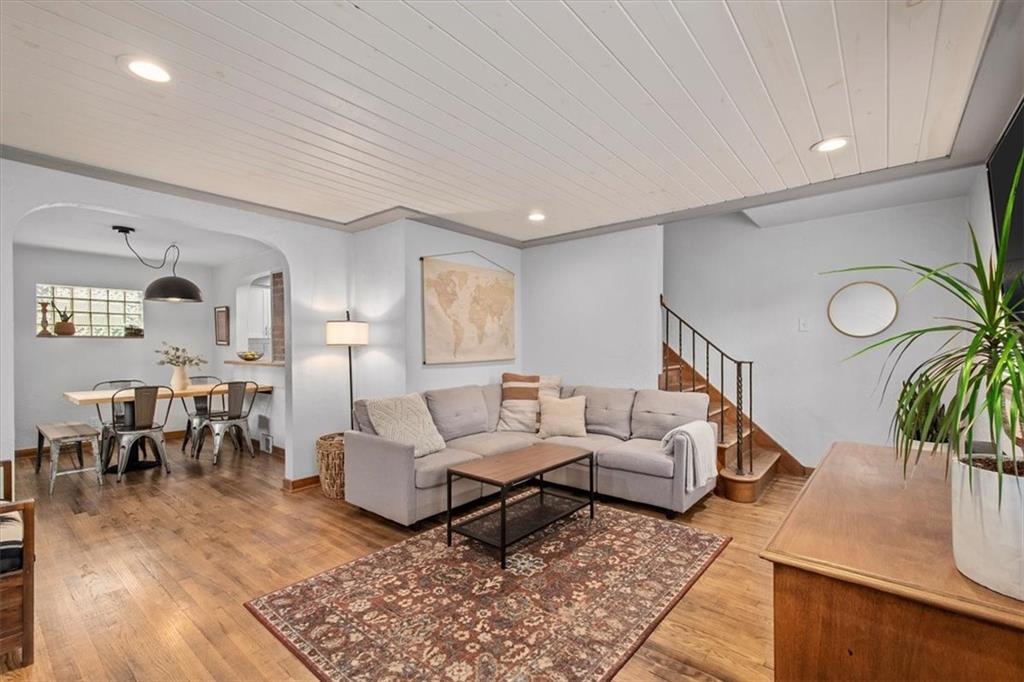 4746 Theodore Street Homestead, PA 15120 - Photo 6 of 25 a living room with furniture and wooden floor