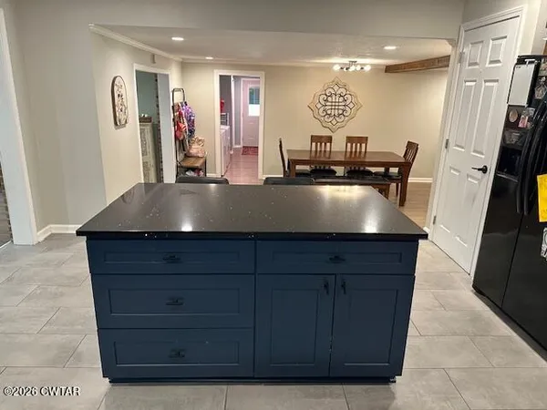 a room with a cabinet and a mirror