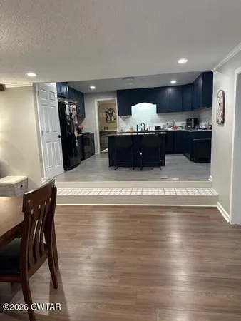 a view of entryway and kitchen