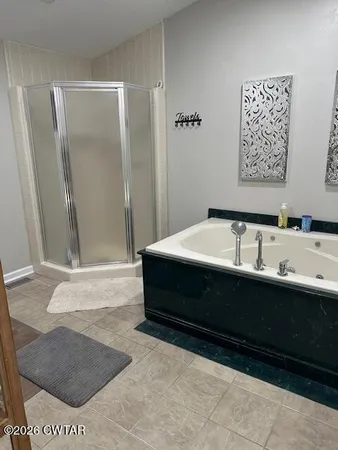 a bathroom with a sink a mirror and a bathtub