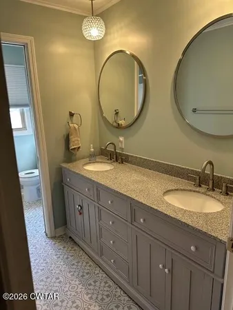 a bathroom with bathtub and shower