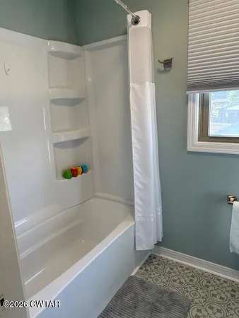 a bathroom with a toilet and a sink