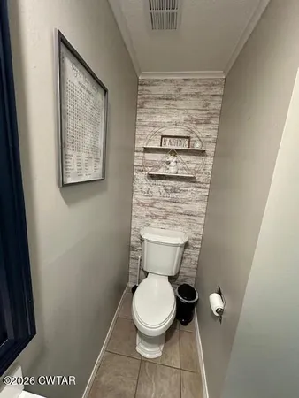 a room with a sink and mirror
