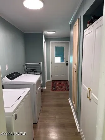 a view of a house with a yard balcony and sitting area