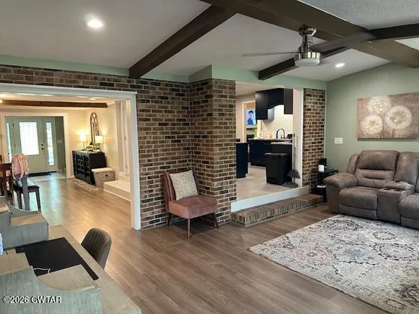 a living room with furniture and a fireplace
