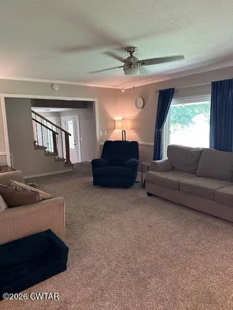 a living room with furniture and a window