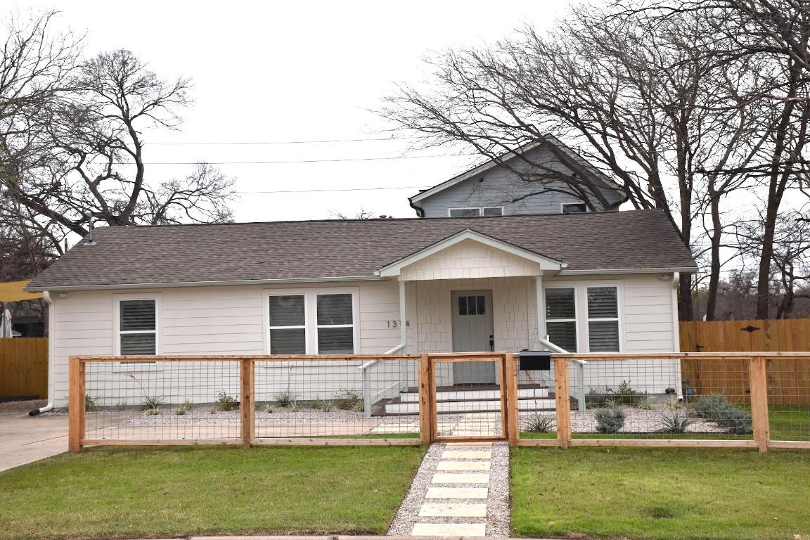 1314 East 13th Street Austin, TX 78702 - Photo 2 of 20 a front view of a house with a yard table and chairs