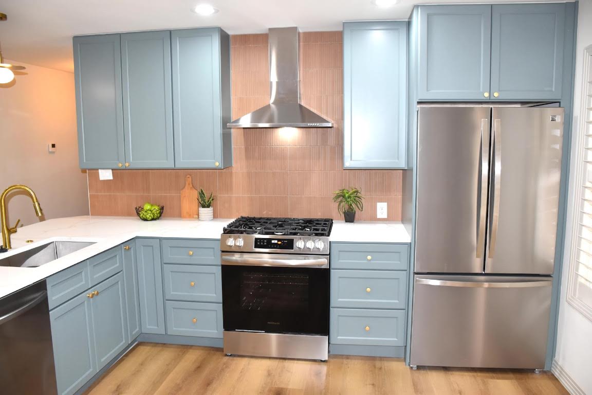 1314 East 13th Street Austin, TX 78702 - Photo 10 of 20 a kitchen with a refrigerator stove and sink