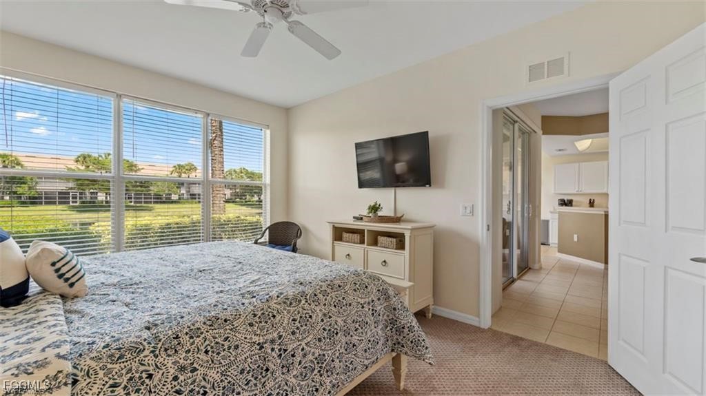 9582 Hemingway Lane, Unit 3402 Fort Myers, FL 33913 - Photo 14 of 27 a living room with hardwood floor and a flat screen tv