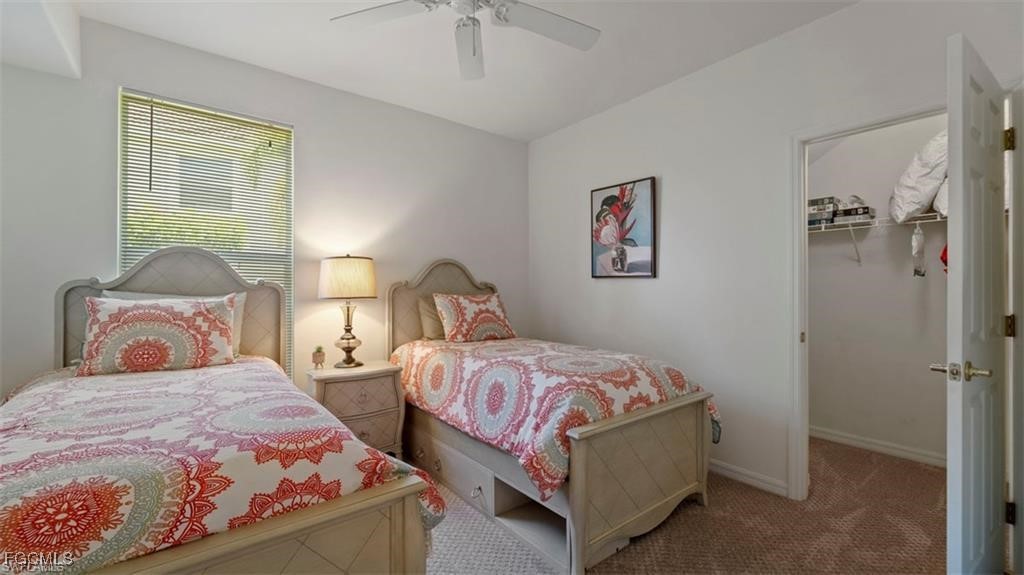 9582 Hemingway Lane, Unit 3402 Fort Myers, FL 33913 - Photo 17 of 27 a bedroom with two beds and a table