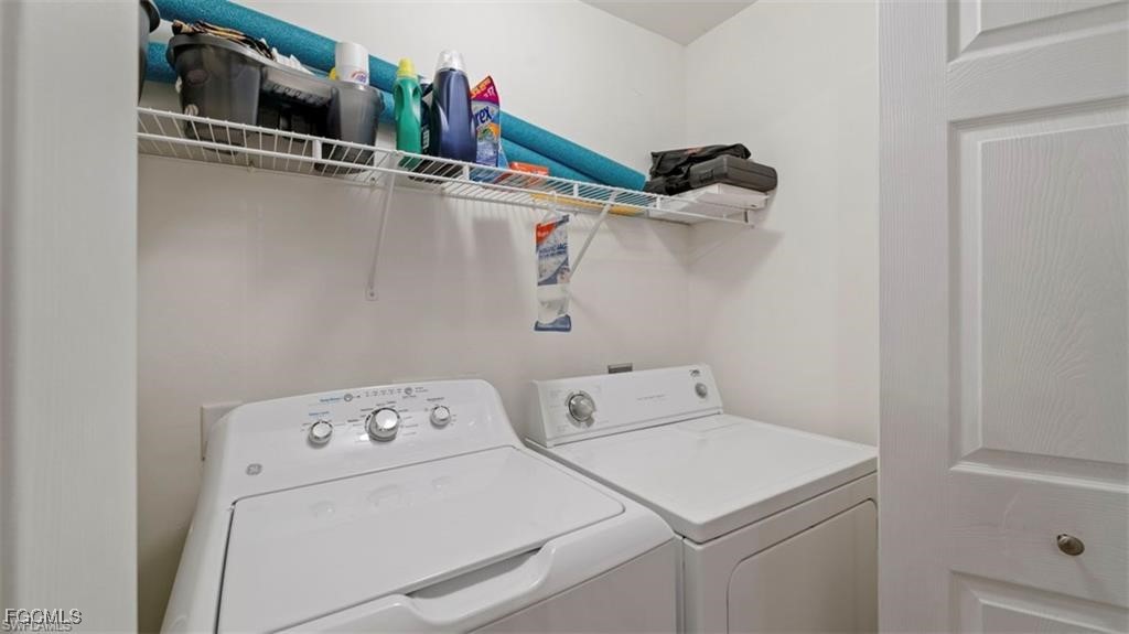 9582 Hemingway Lane, Unit 3402 Fort Myers, FL 33913 - Photo 19 of 27 a utility room with dryer and washer