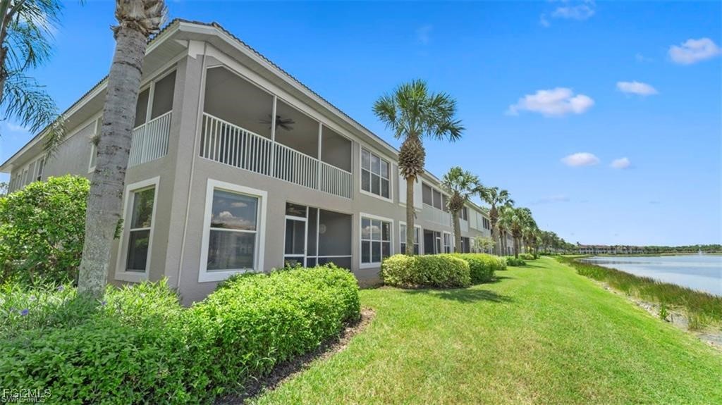 9582 Hemingway Lane, Unit 3402 Fort Myers, FL 33913 - Photo 22 of 27 a front view of a house with a yard