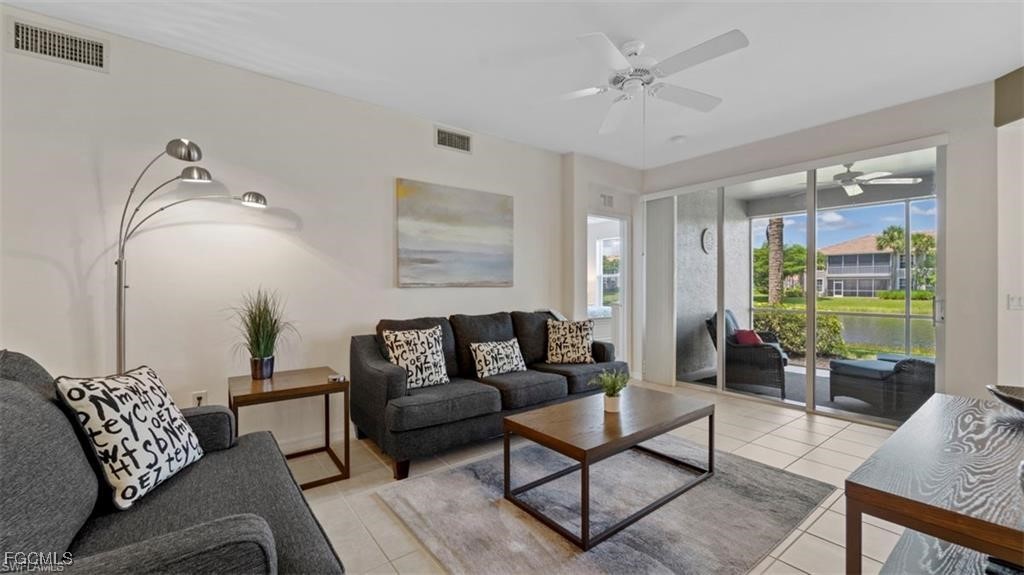 9582 Hemingway Lane, Unit 3402 Fort Myers, FL 33913 - Photo 4 of 27 a living room with furniture and a large window