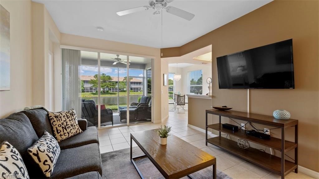 9582 Hemingway Lane, Unit 3402 Fort Myers, FL 33913 - Photo 5 of 27 a living room with furniture and a flat screen tv