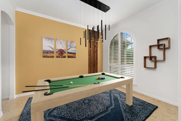 a room with window and tables