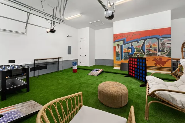 a view of a porch with furniture and garden