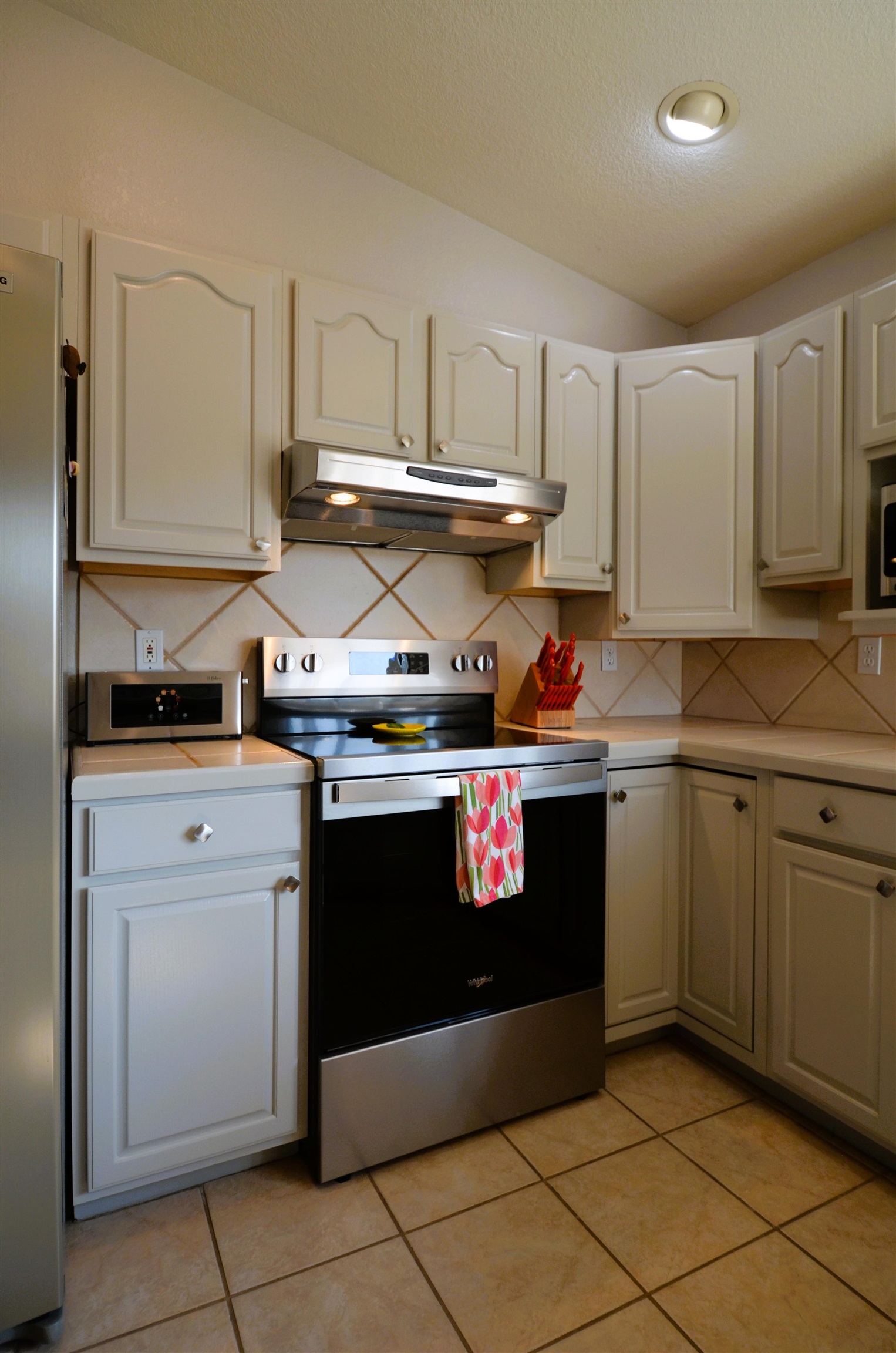1459 Racquet Way Grand Junction, CO 81506 - Photo 17 of 42 a kitchen with stainless steel appliances granite countertop a stove a sink and dishwasher