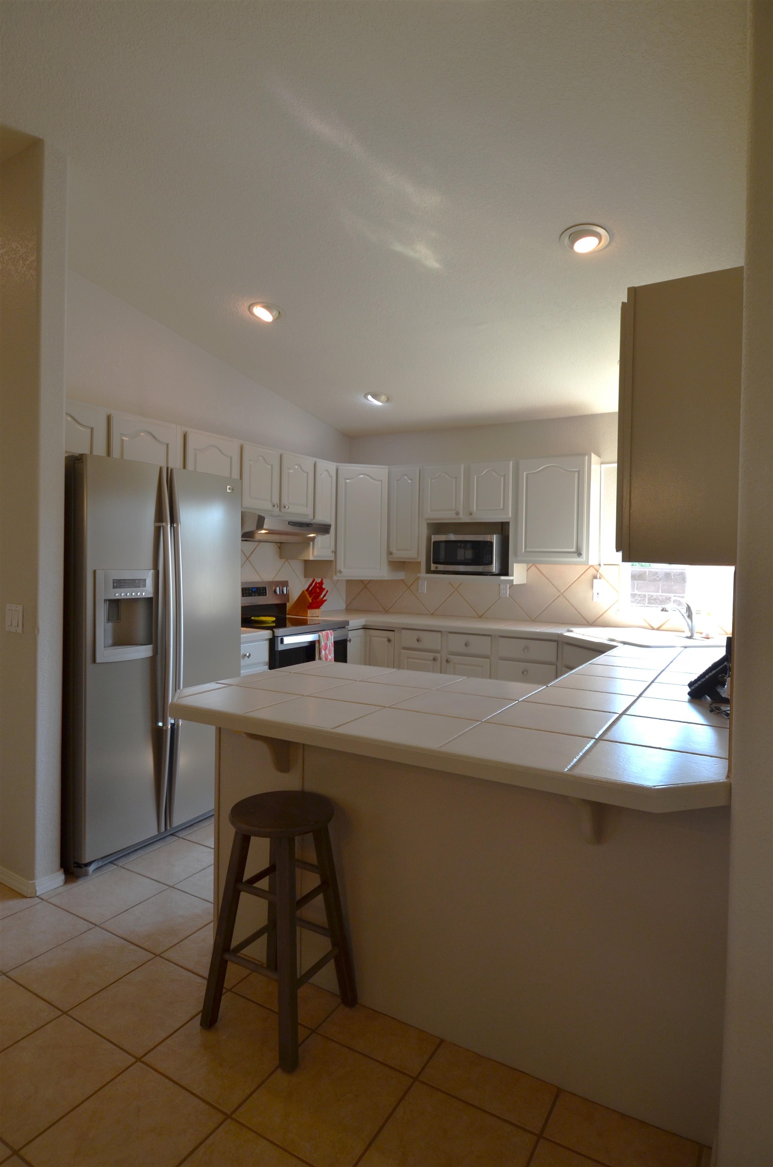 1459 Racquet Way Grand Junction, CO 81506 - Photo 21 of 42 a kitchen with stainless steel appliances a refrigerator and a stove