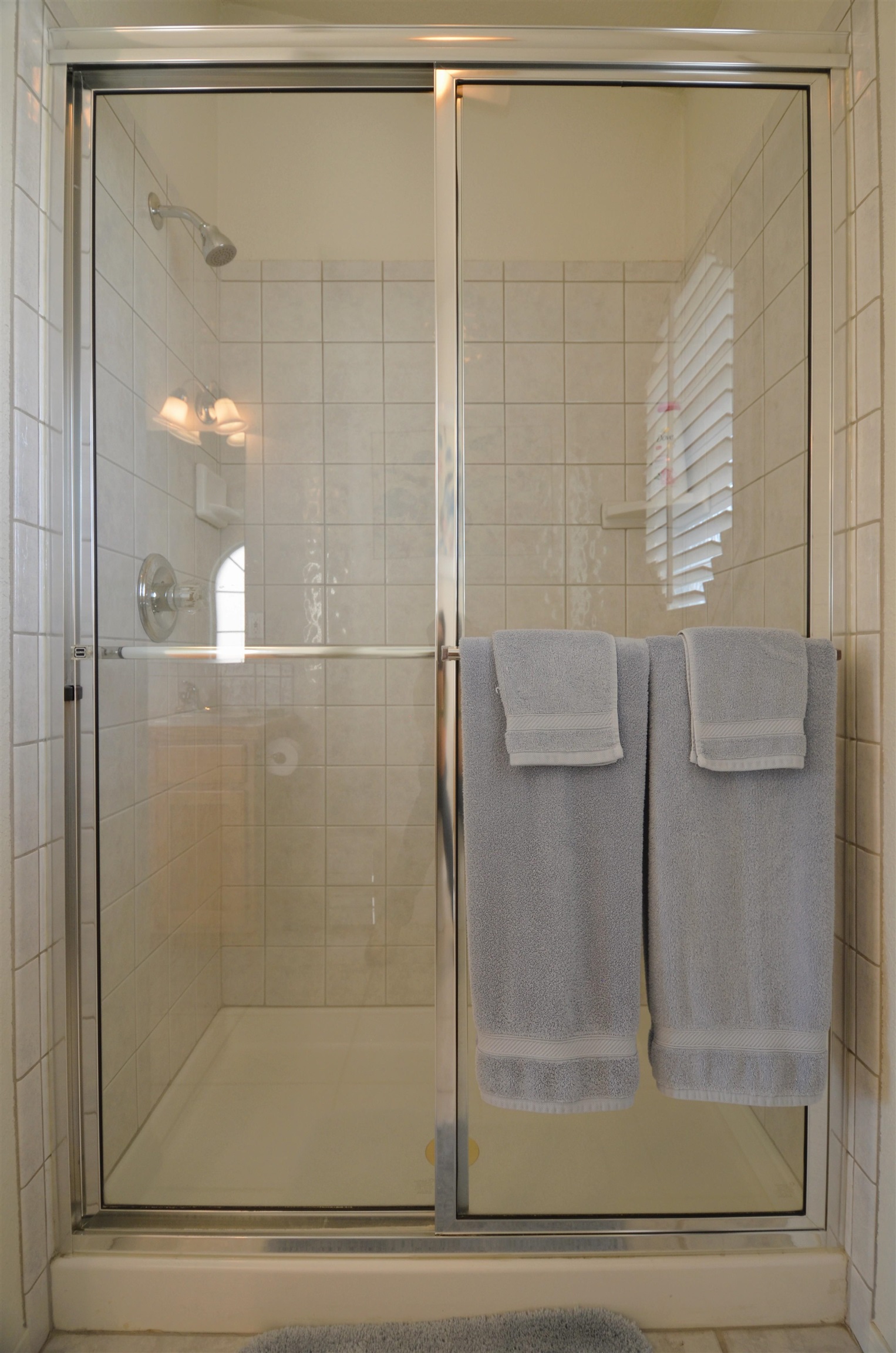 1459 Racquet Way Grand Junction, CO 81506 - Photo 31 of 42 a bathroom with a glass shower door