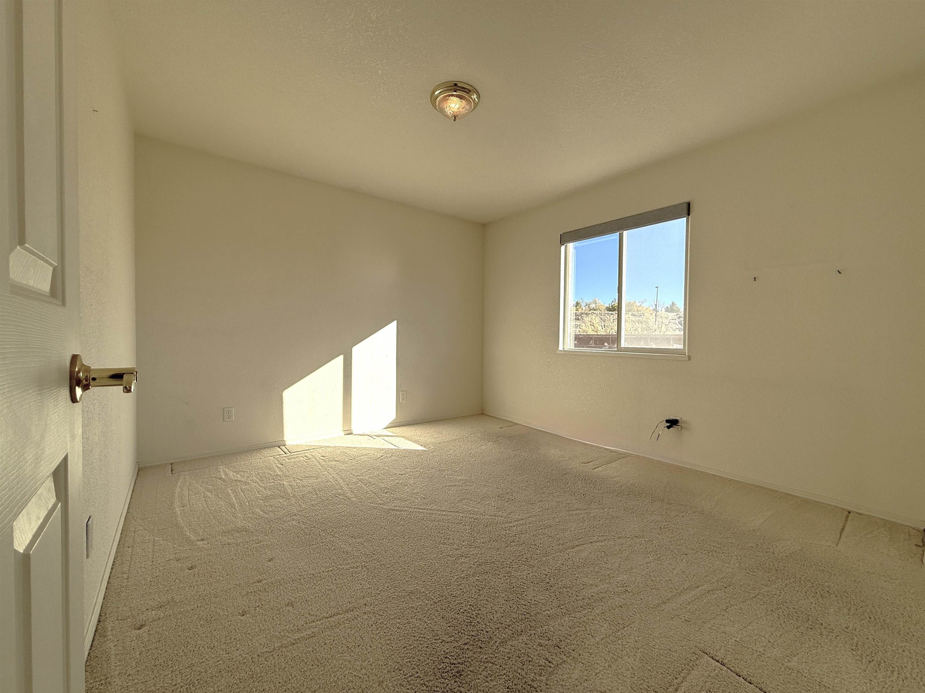 1459 Racquet Way Grand Junction, CO 81506 - Photo 36 of 42 a view of an empty room and a window