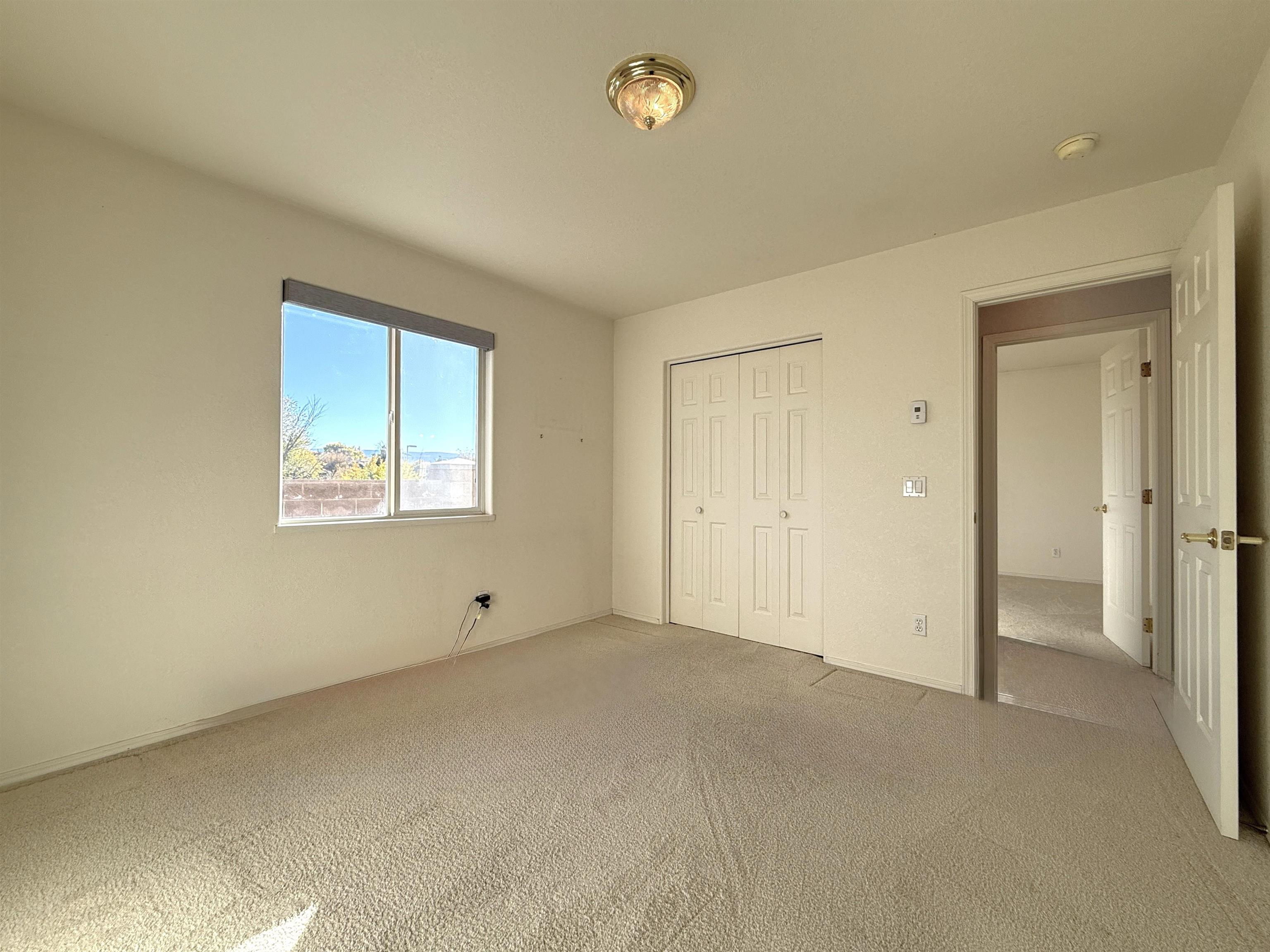 1459 Racquet Way Grand Junction, CO 81506 - Photo 37 of 42 a view of an empty room with a window