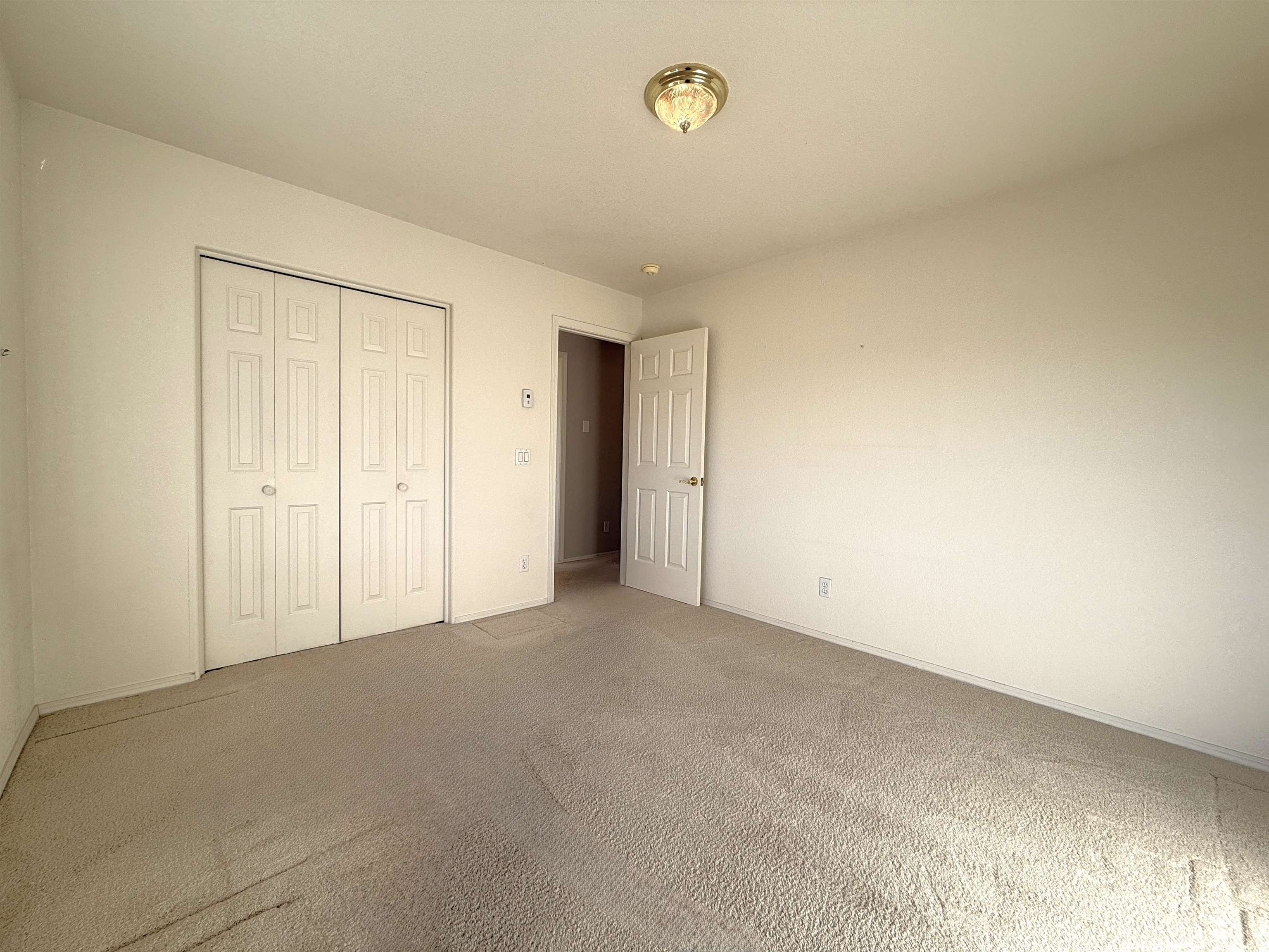 1459 Racquet Way Grand Junction, CO 81506 - Photo 38 of 42 an empty room with a natural light