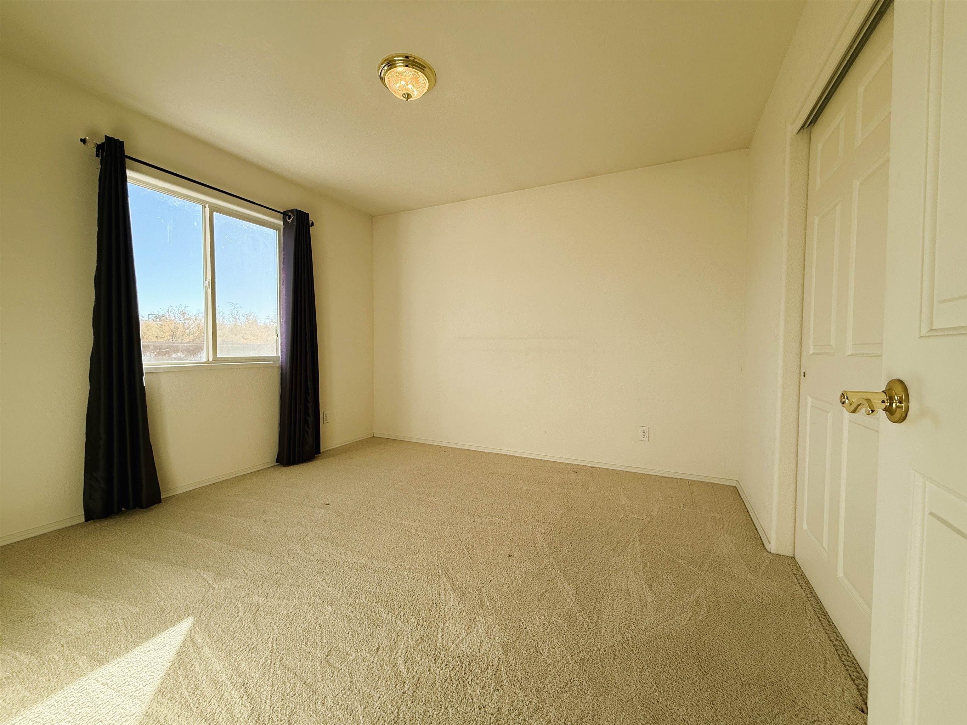 1459 Racquet Way Grand Junction, CO 81506 - Photo 40 of 42 a view of an empty room and a window