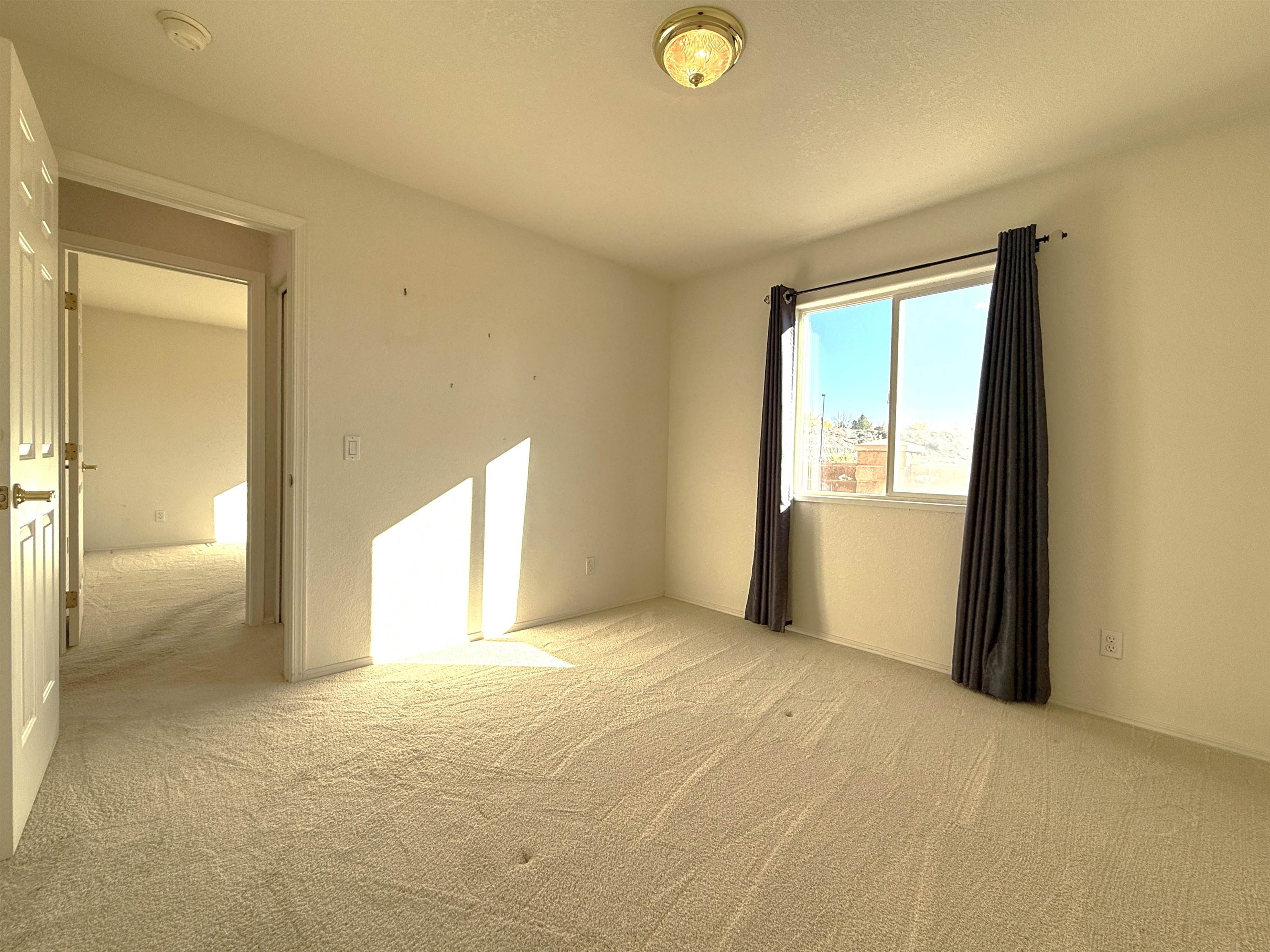 1459 Racquet Way Grand Junction, CO 81506 - Photo 41 of 42 a view of empty room with wooden floor and fan