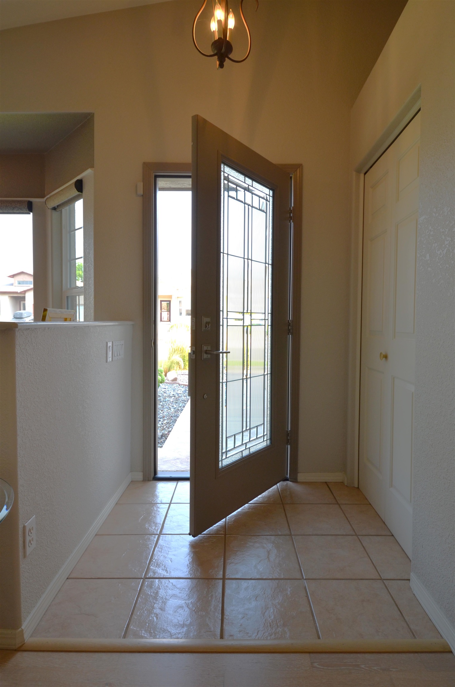 1459 Racquet Way Grand Junction, CO 81506 - Photo 10 of 42 a view of an empty room with chandelier fan and windows