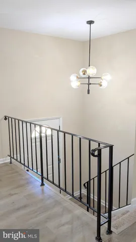 a view of a hallway with a chandelier