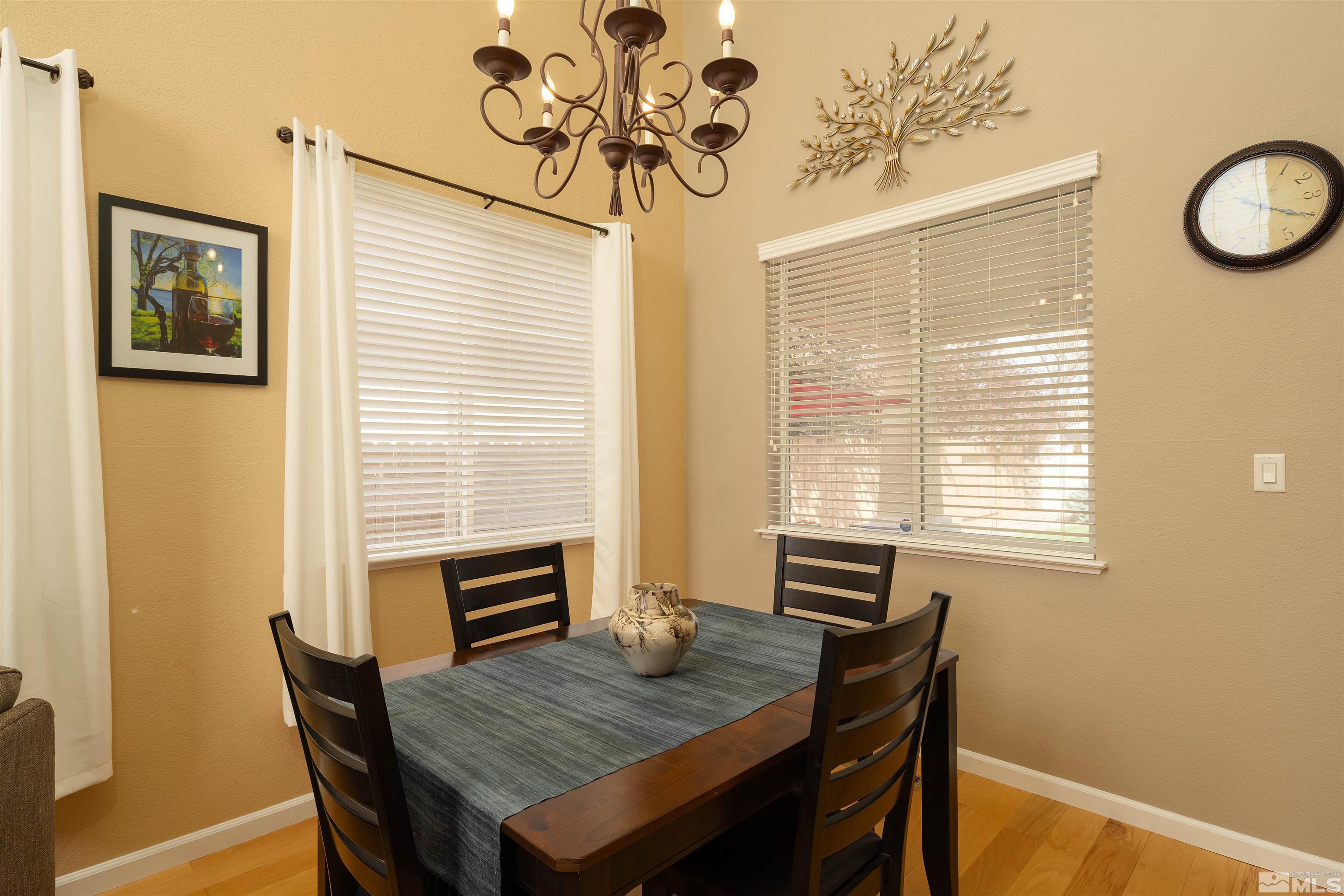 2325 Lincoln Meadows Drive Reno, NV 89521 - Photo 11 of 33 a view of a dining room with furniture window and wooden floor