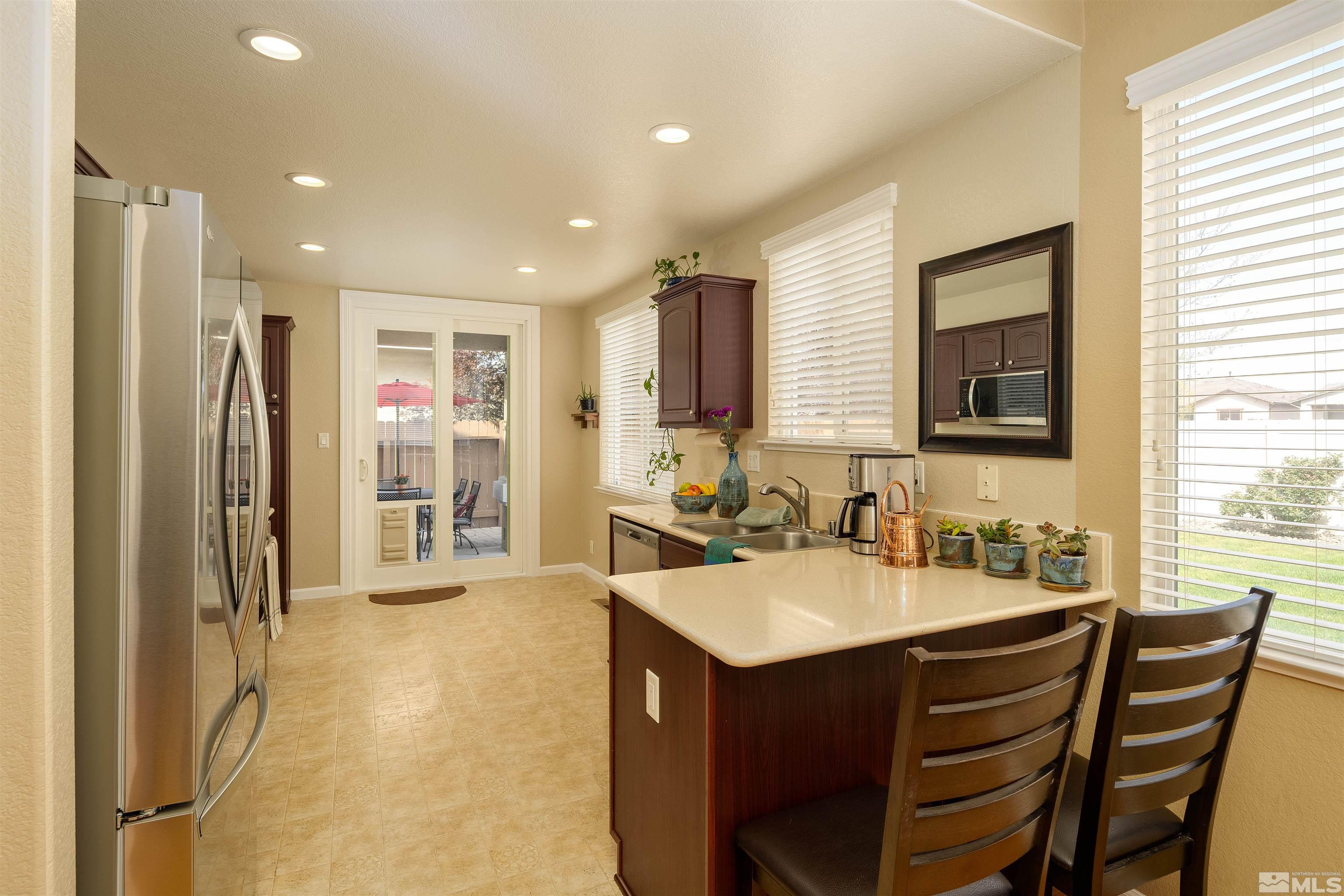 2325 Lincoln Meadows Drive Reno, NV 89521 - Photo 14 of 33 a kitchen with a sink appliances and cabinets