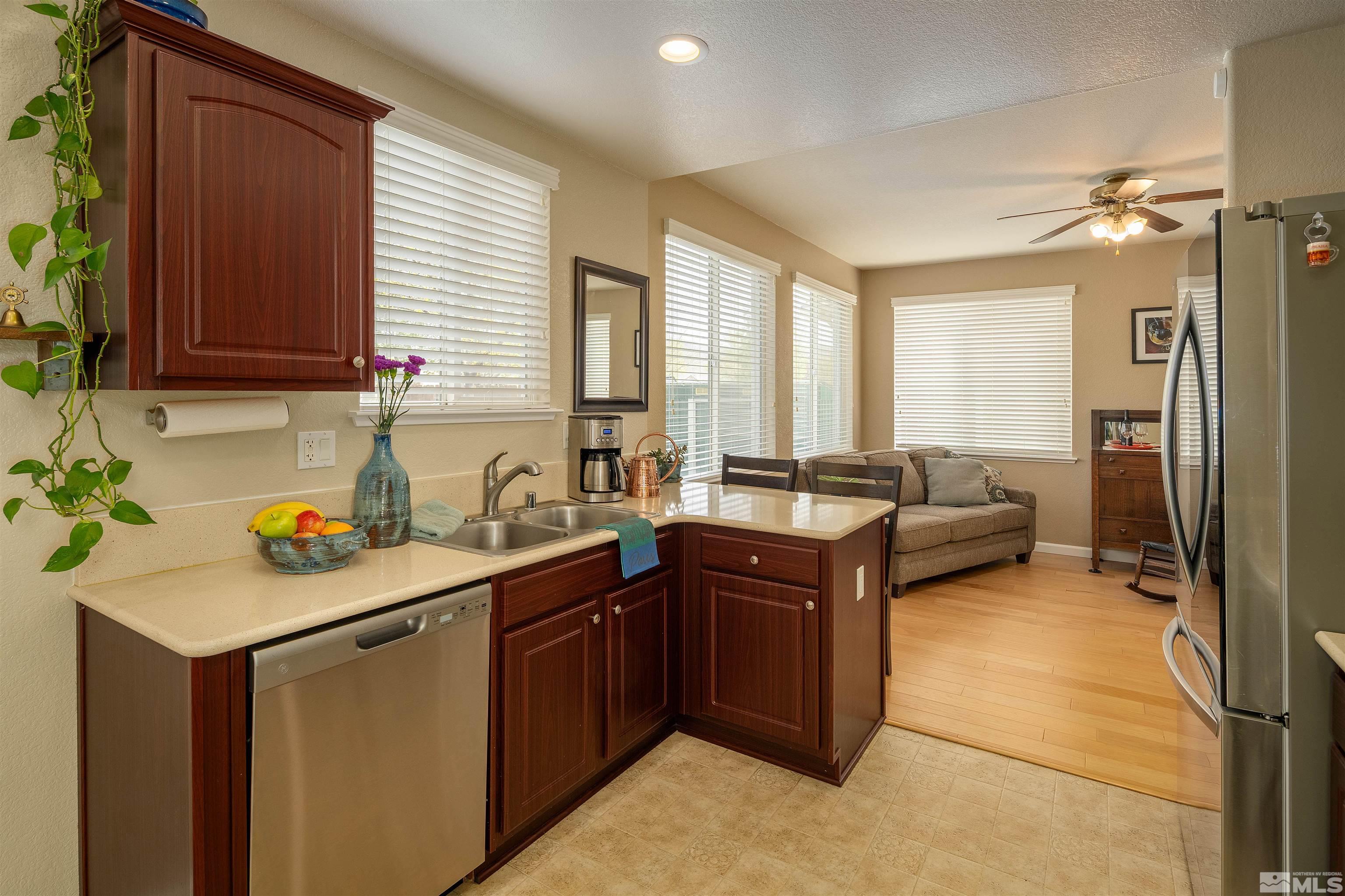 2325 Lincoln Meadows Drive Reno, NV 89521 - Photo 16 of 33 a kitchen with a sink and a refrigerator