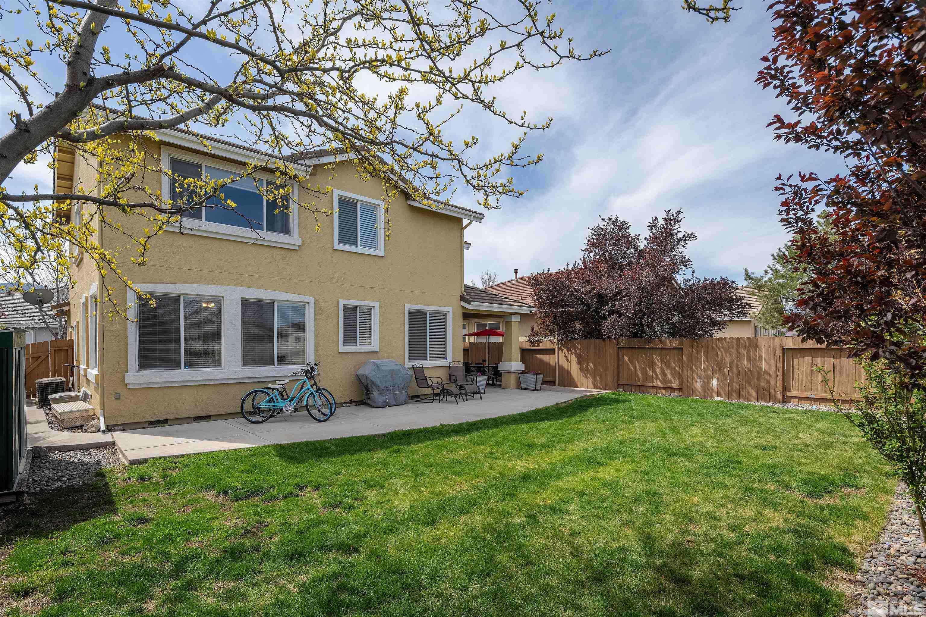 2325 Lincoln Meadows Drive Reno, NV 89521 - Photo 23 of 33 a front view of house with yard and seating area