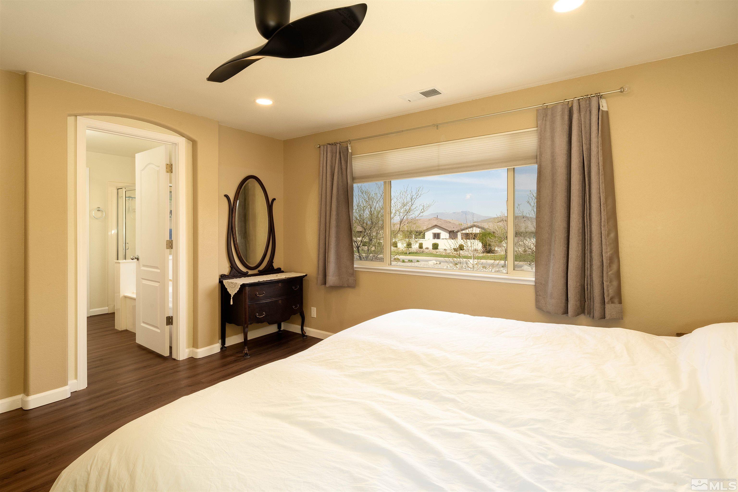 2325 Lincoln Meadows Drive Reno, NV 89521 - Photo 28 of 33 a spacious bedroom with a bed and a dresser