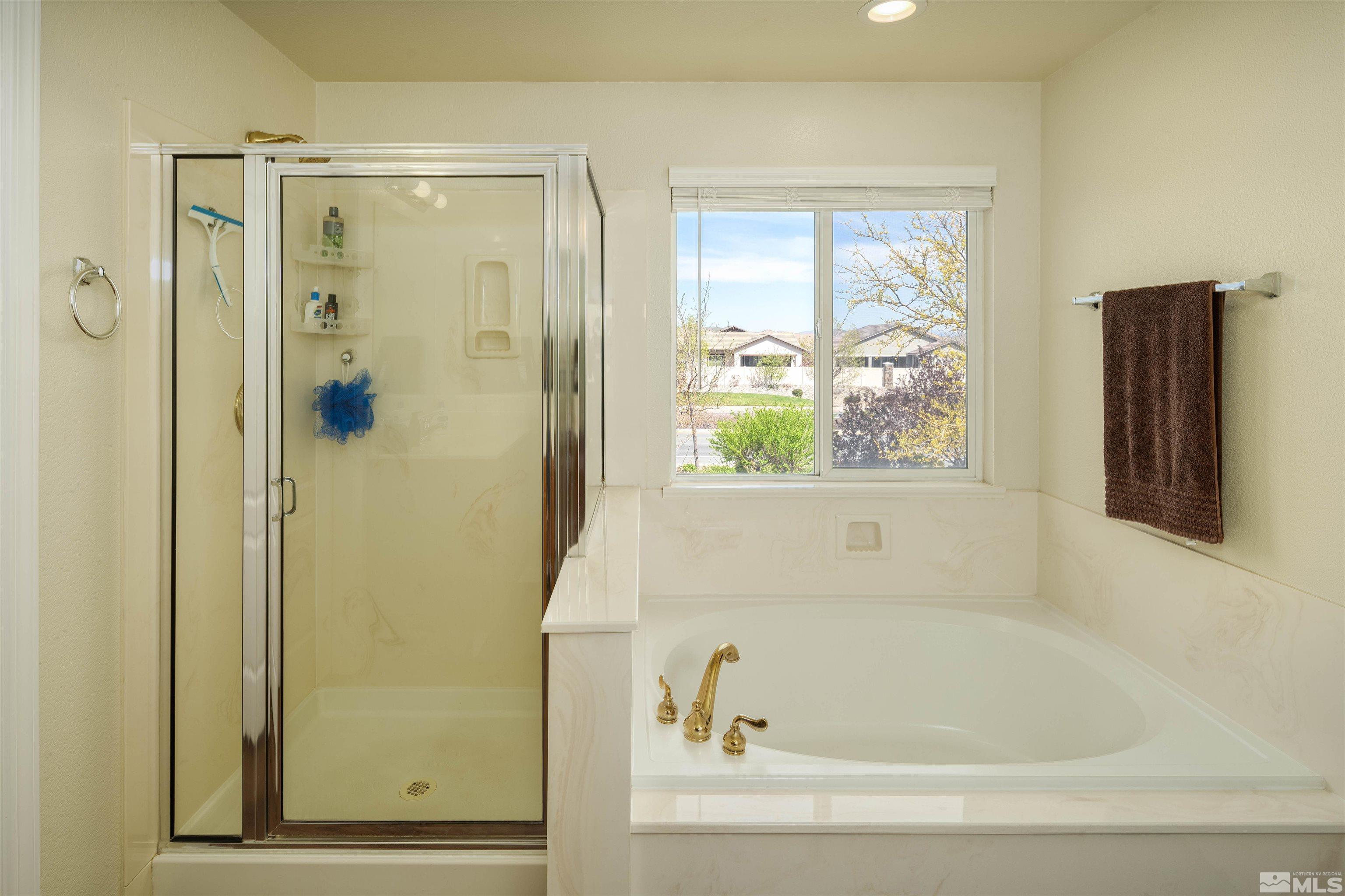 2325 Lincoln Meadows Drive Reno, NV 89521 - Photo 29 of 33 a bathroom with a bathtub and a shower